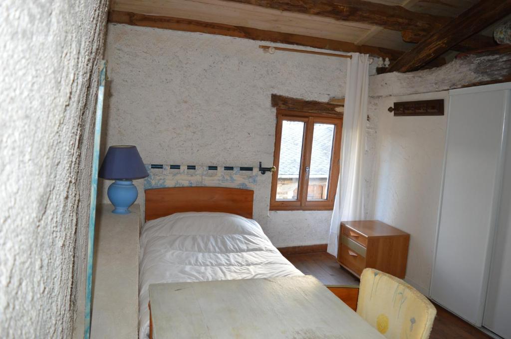 Postel nebo postele na pokoji v ubytování Les Ecuries de la Sabatarié