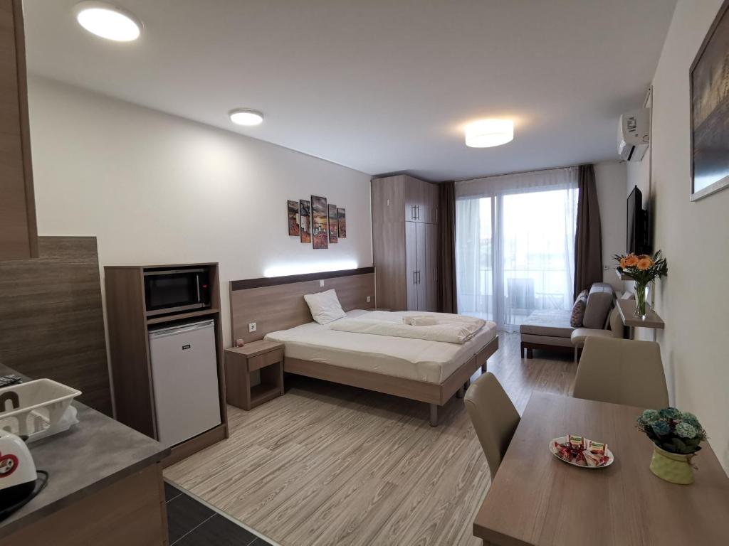 A bed or beds in a room at Corvin holiday Apartments hotel