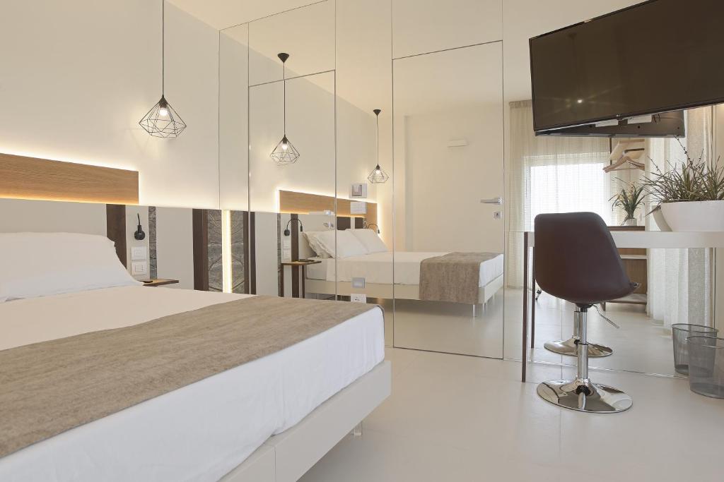Postel nebo postele na pokoji v ubytování Hedoné Design Experience B&B