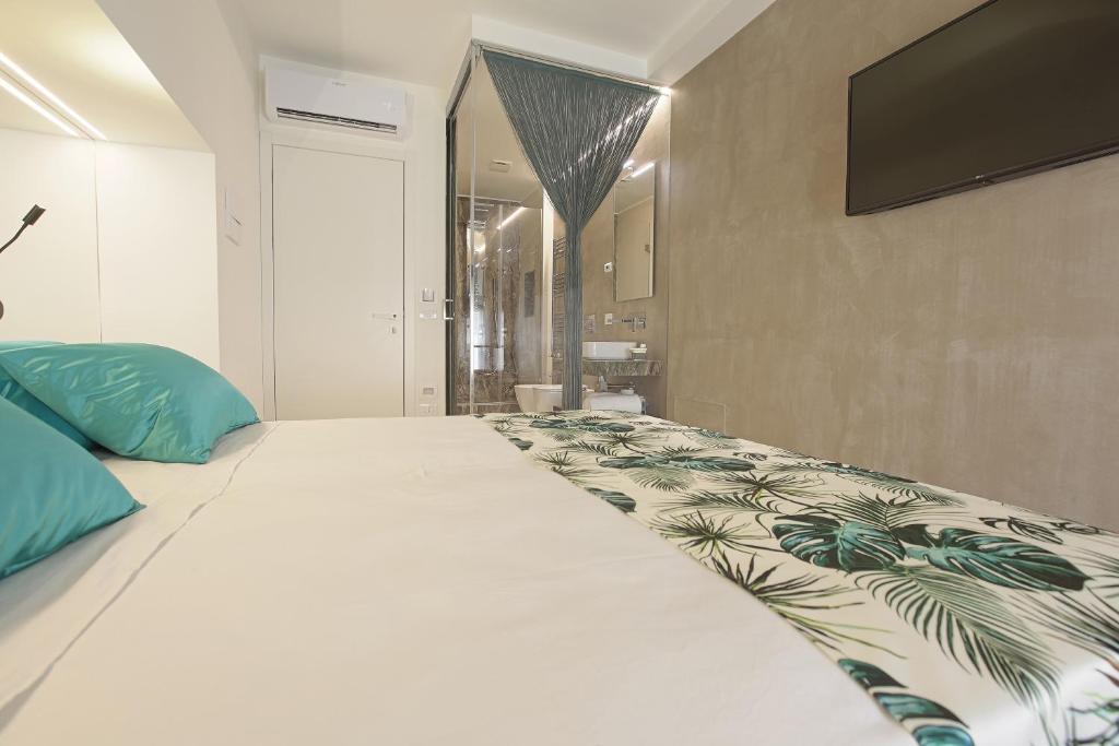 Postel nebo postele na pokoji v ubytování Hedoné Design Experience B&B