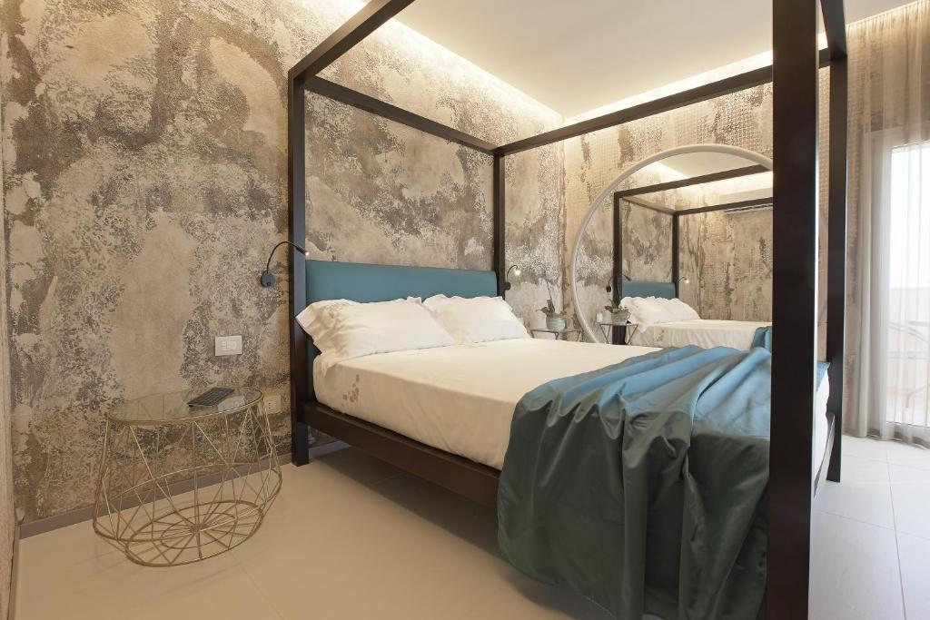 Postel nebo postele na pokoji v ubytování Hedoné Design Experience B&B