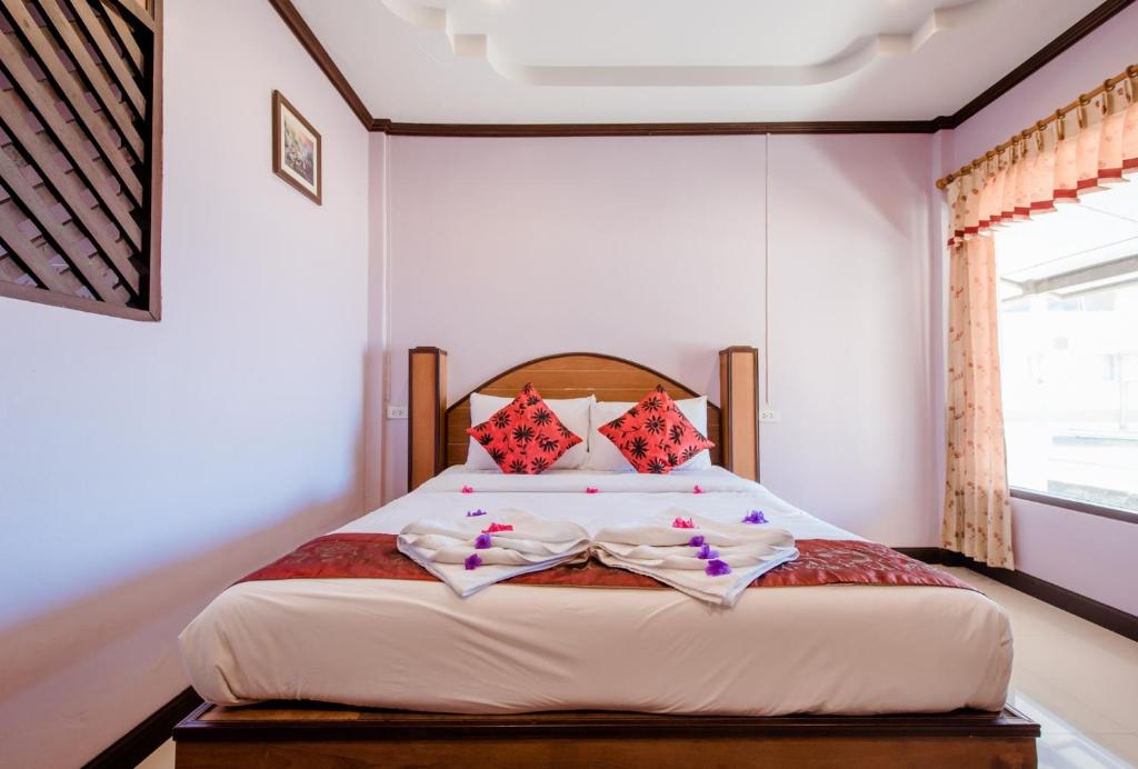 Postel nebo postele na pokoji v ubytování Baan Rabieng Resort