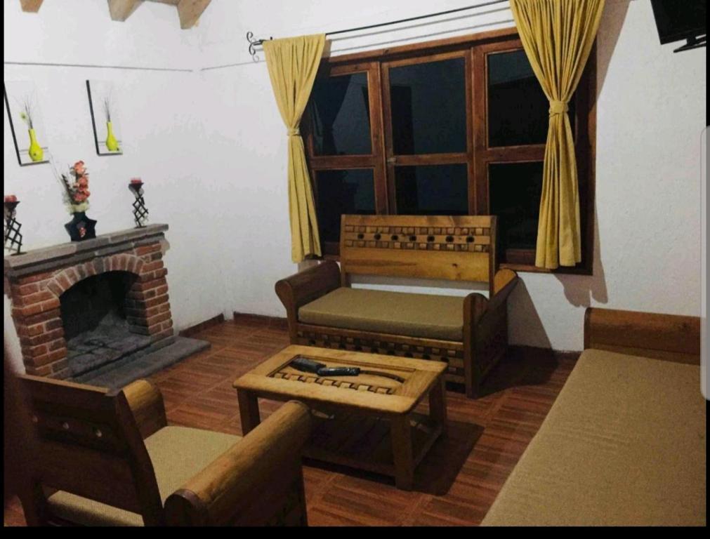 Posezení v ubytování Cabañas los cactus 2
