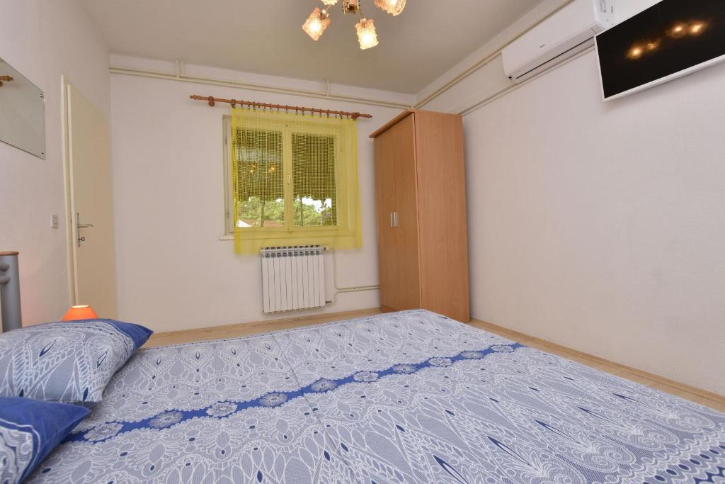 Posteľ alebo postele v izbe v ubytovaní Apartment Dijo I