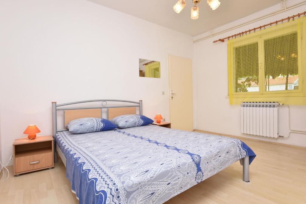Posteľ alebo postele v izbe v ubytovaní Apartment Dijo I