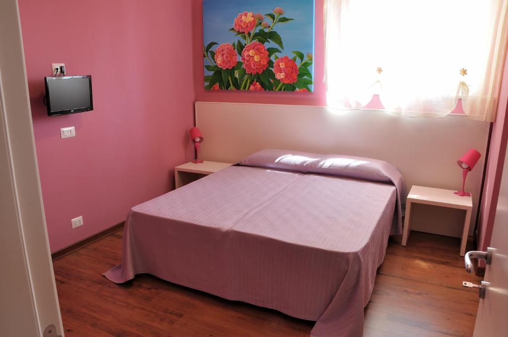 Postel nebo postele na pokoji v ubytování I Tre Fiori