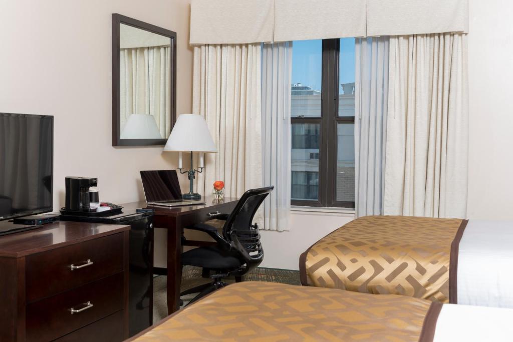 Postel nebo postele na pokoji v ubytování Chicago South Loop Hotel