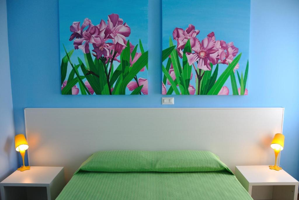 Postel nebo postele na pokoji v ubytování I Tre Fiori