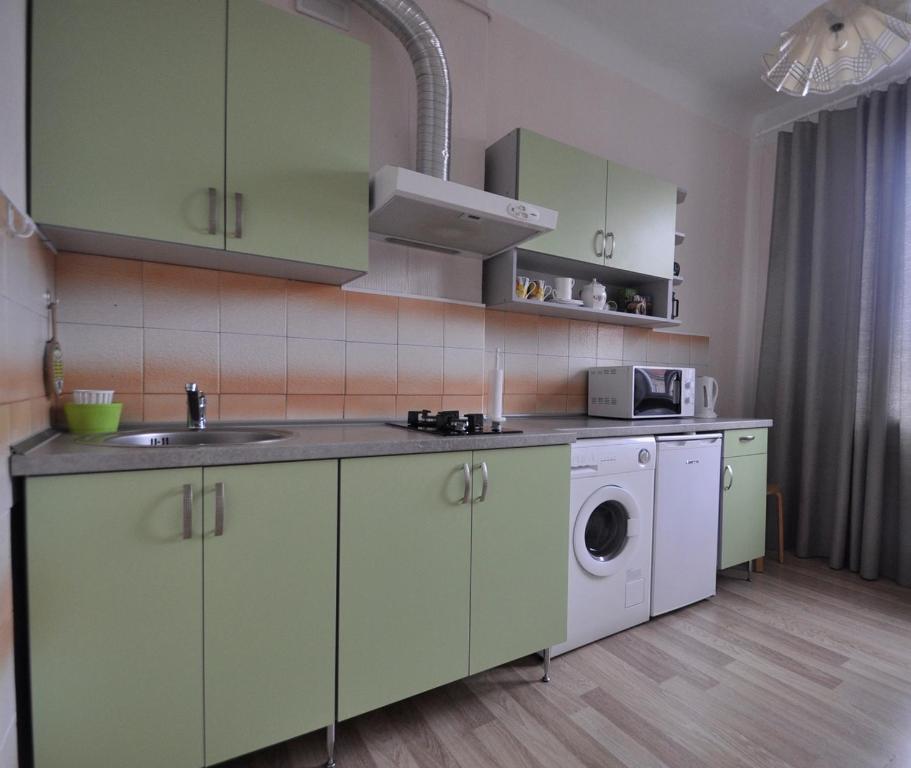 Kuchyň nebo kuchyňský kout v ubytování Castle View Apartment