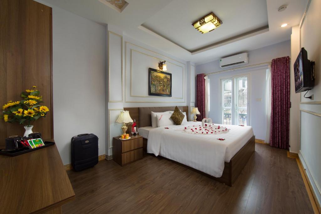 Postel nebo postele na pokoji v ubytování Hanoi City Gate Hotel