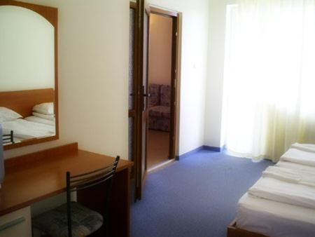 Postel nebo postele na pokoji v ubytování Family Hotel ATLAS