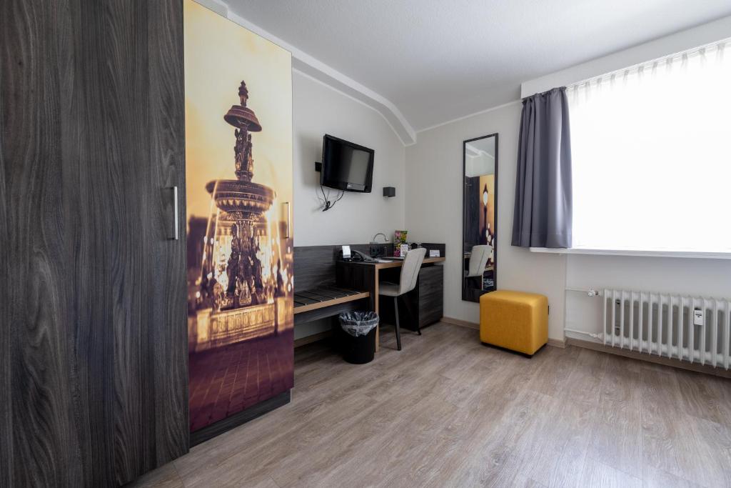 TV a/nebo společenská místnost v ubytování Art Hotel Aachen