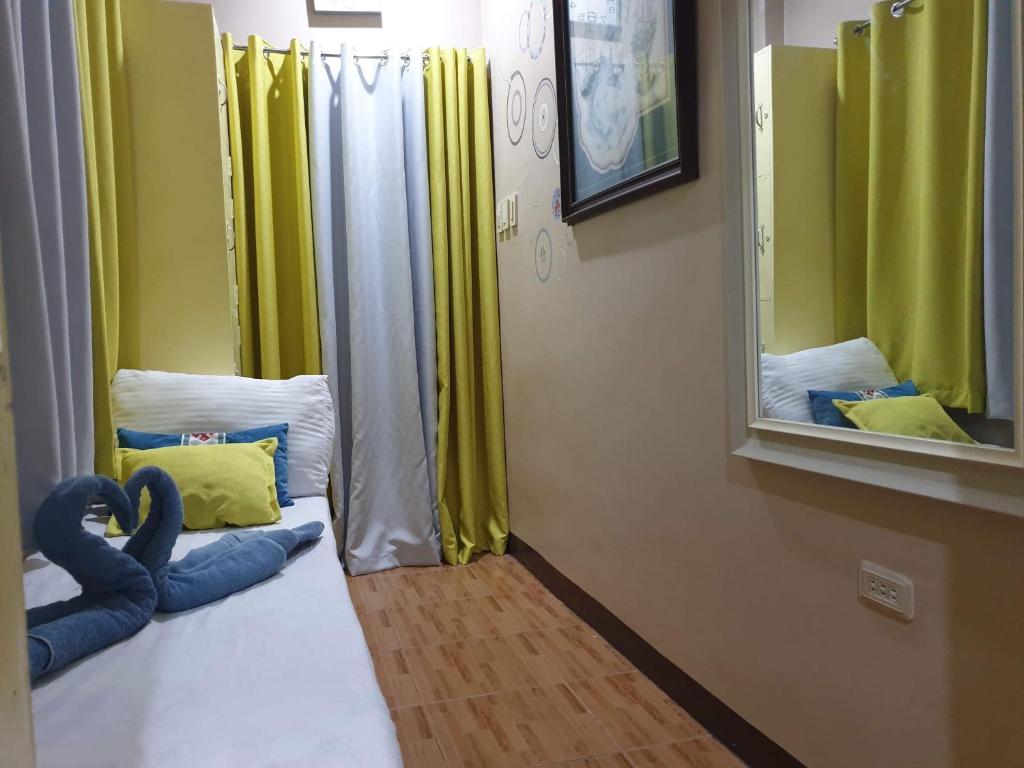 Postel nebo postele na pokoji v ubytování Palompon lodge