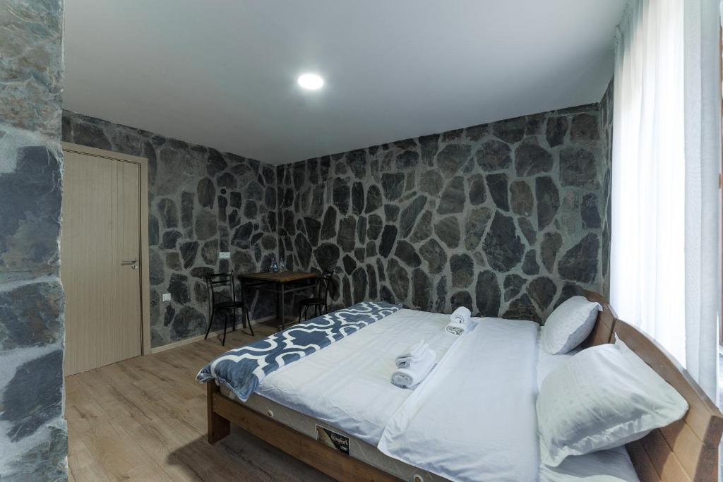 Postel nebo postele na pokoji v ubytování Hotel Complex Nabadi