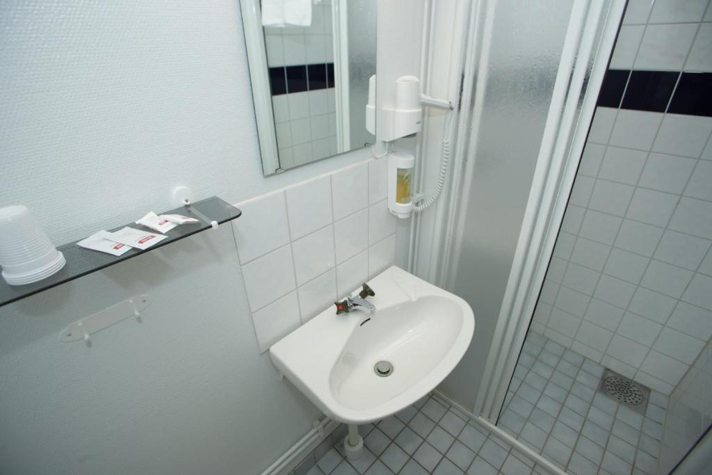Koupelna v ubytování Yxnerum Hotell