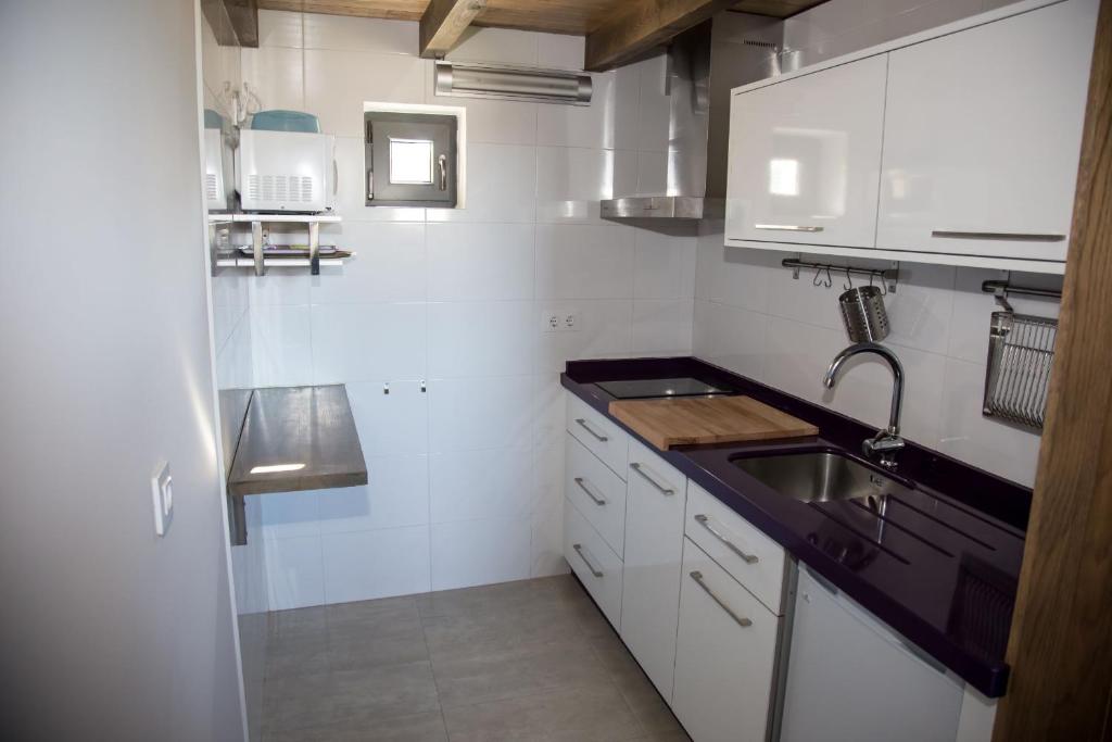 Kuchyň nebo kuchyňský kout v ubytování A casa do viveiro