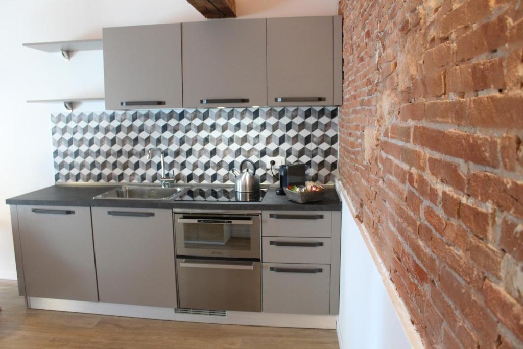 Kuchnia lub aneks kuchenny w obiekcie UnicumHouse Verona