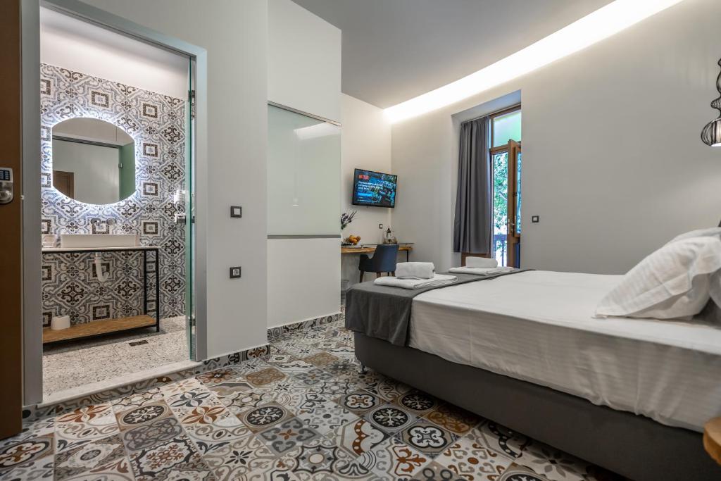 Postel nebo postele na pokoji v ubytování Casa Poli Suites