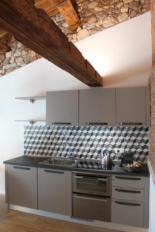 Kuchnia lub aneks kuchenny w obiekcie UnicumHouse Verona