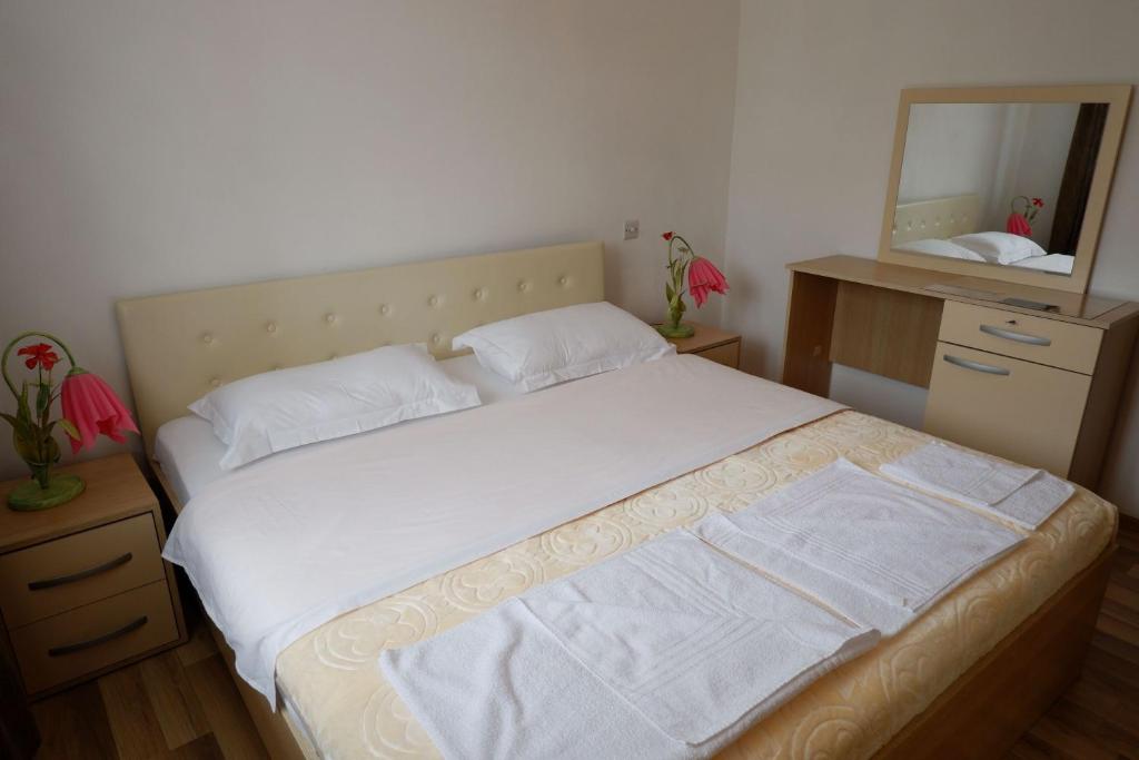 Postel nebo postele na pokoji v ubytování Hotel Kings Apartments
