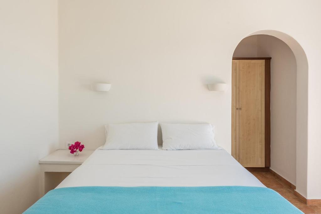 Postel nebo postele na pokoji v ubytování Asterias House