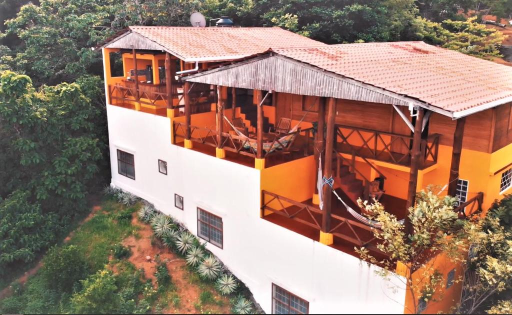 an overhead view of a building with a roof at Buena Onda Backpackers in San Juan del Sur