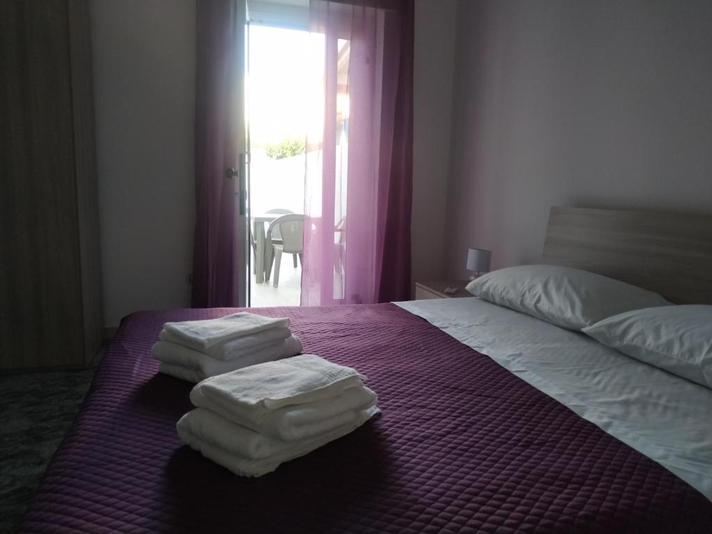 Postel nebo postele na pokoji v ubytování B&B Civico 42