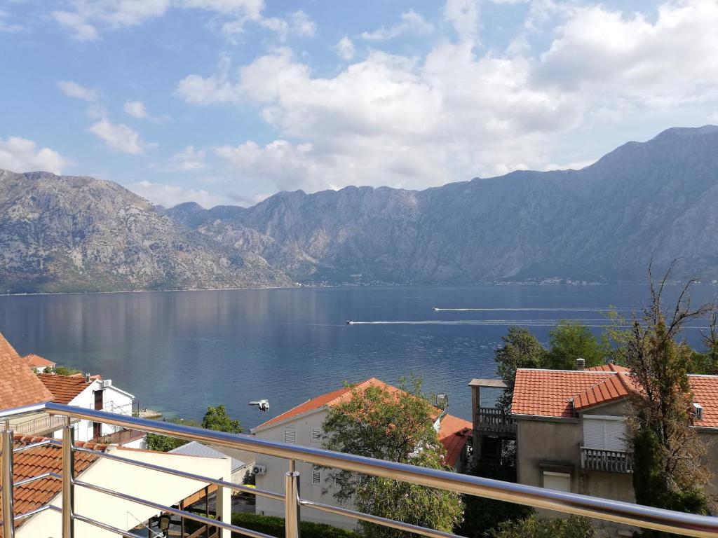 a view of a large body of water with mountains at Ruža Apartments Sea View in Kotor