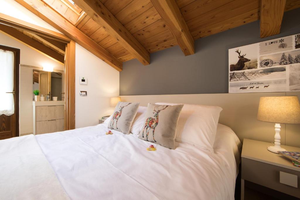 Postel nebo postele na pokoji v ubytování B&B Pousada Rio Aosta-servizi di Bed and breakfast
