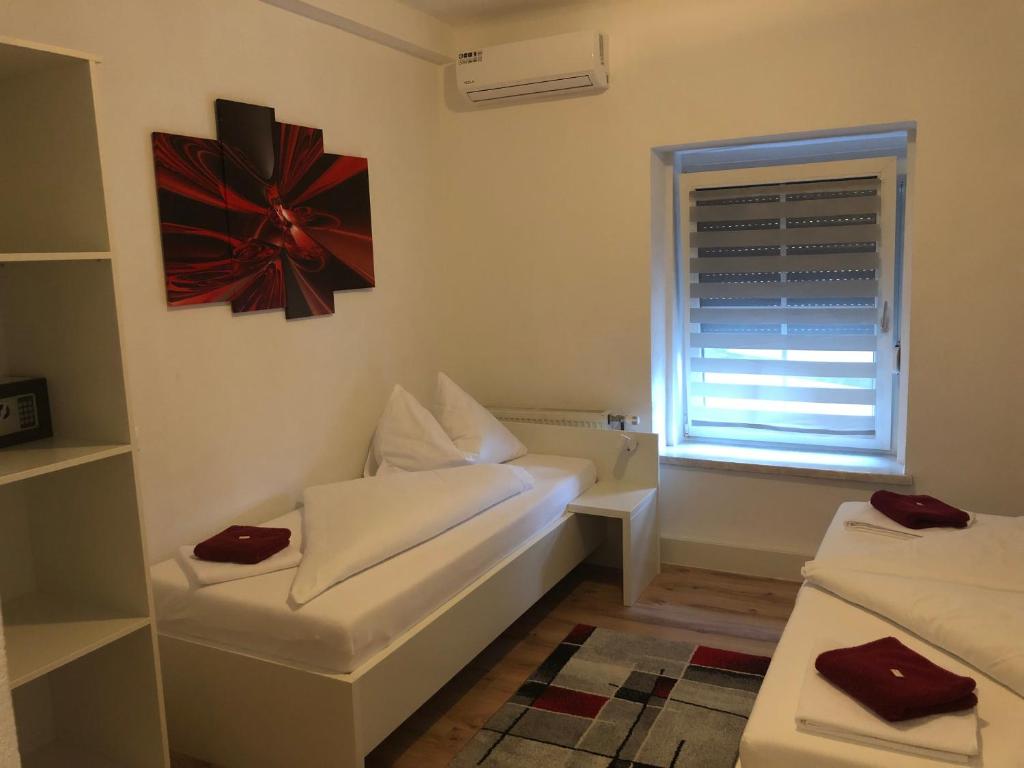 Postel nebo postele na pokoji v ubytování Center Rooms Villach