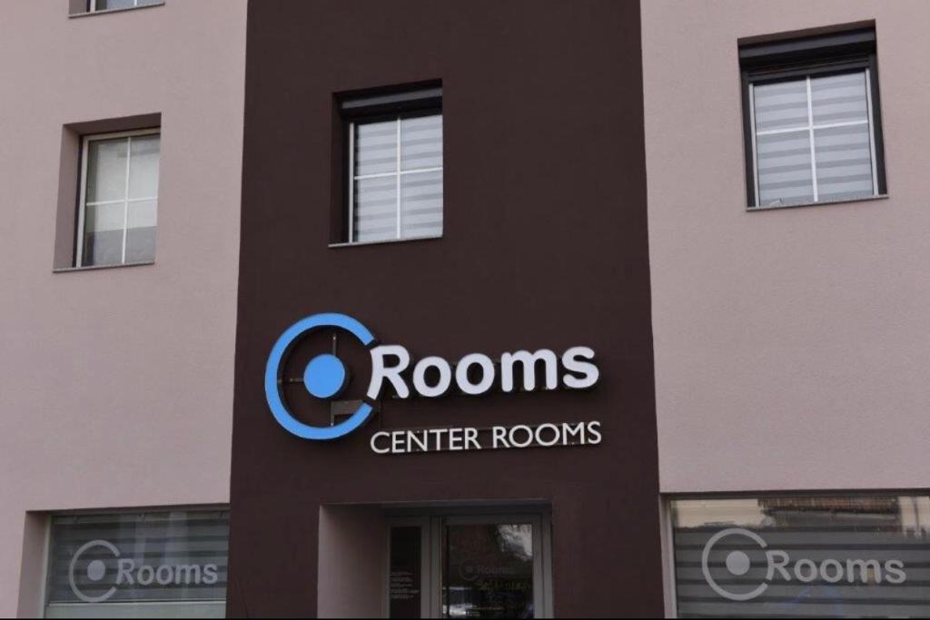 a building with a sign on the side of it at Center Rooms Villach in Villach