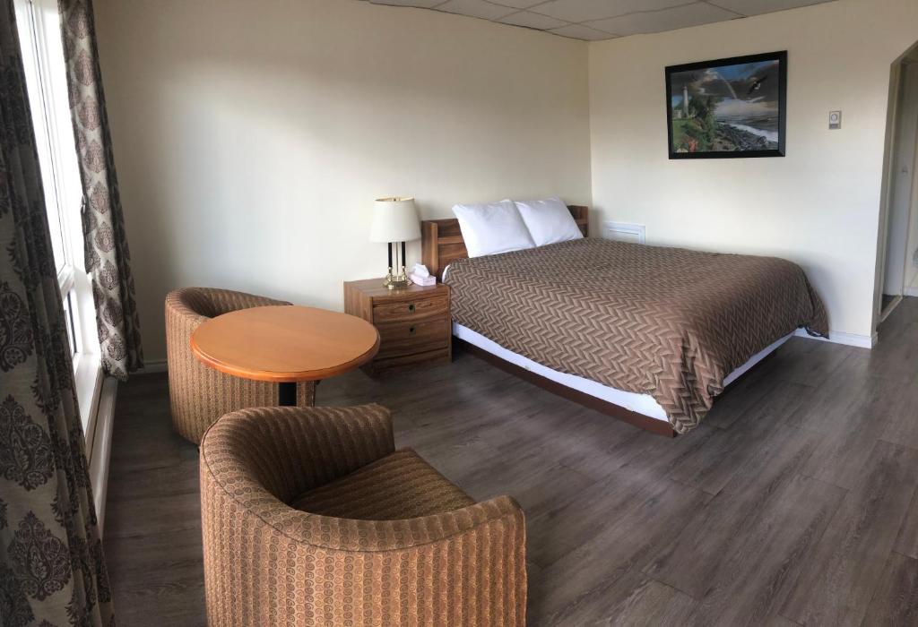 Postel nebo postele na pokoji v ubytování Century Motel