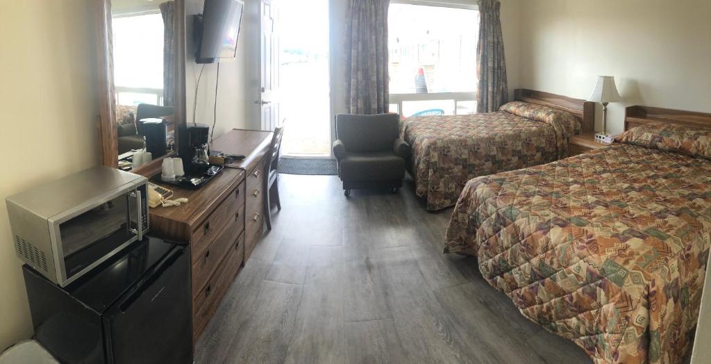 Postel nebo postele na pokoji v ubytování Century Motel