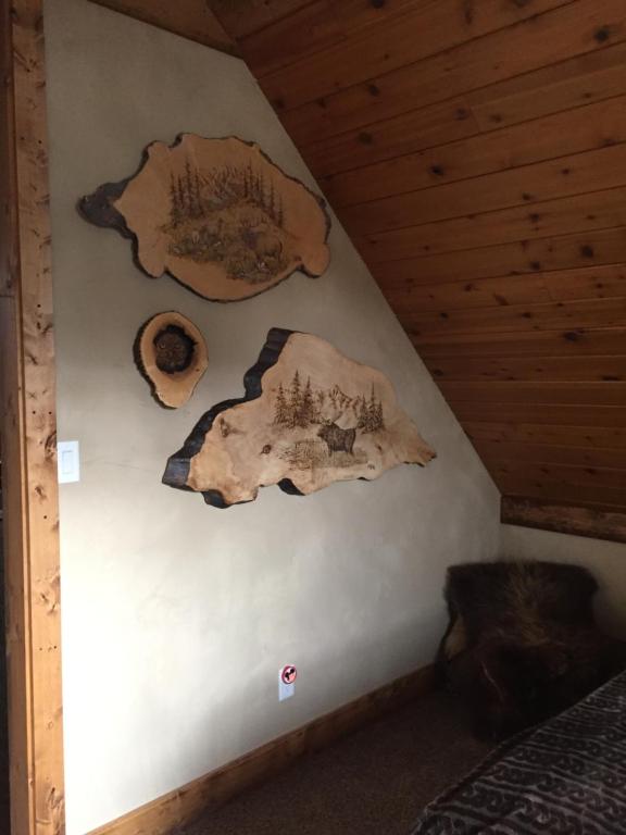 a room with two pieces of art on the wall at The Old Church B&B in Warner