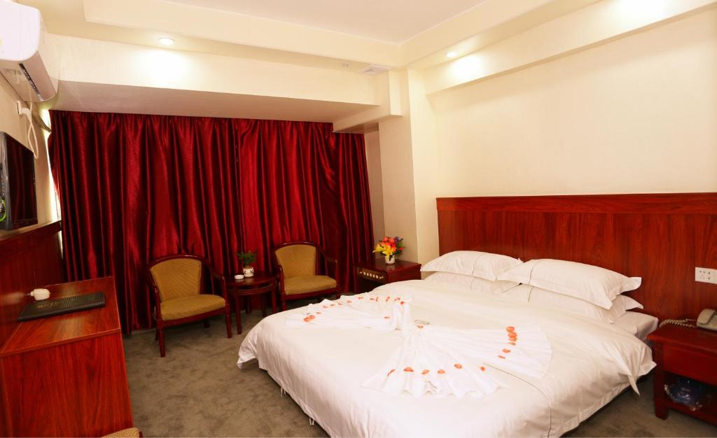 Postel nebo postele na pokoji v ubytování Guangzhou Junshan Hotel - Shuttle bus for Canton Fair