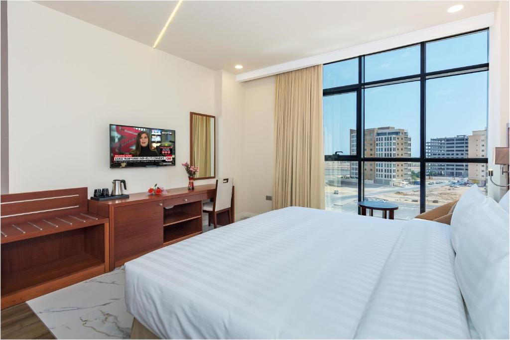 TV a/nebo společenská místnost v ubytování Muscat Gate Hotel