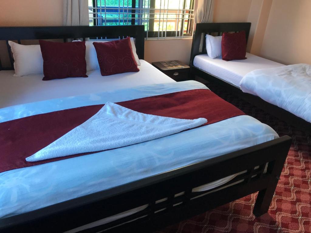 Postel nebo postele na pokoji v ubytování Hotel Brisha Sarangkot