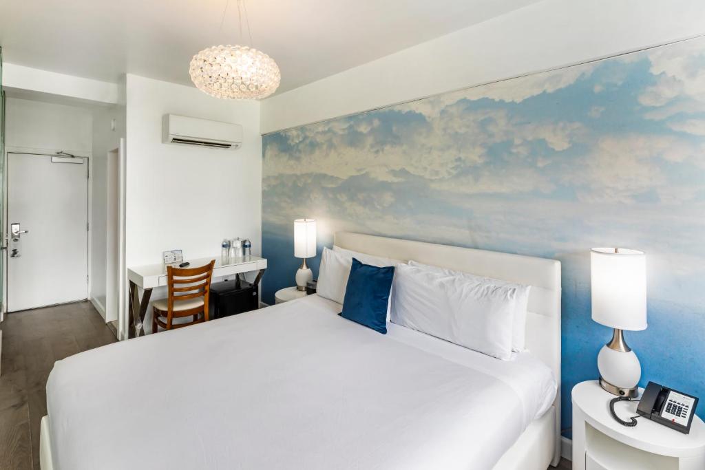 Postel nebo postele na pokoji v ubytování Penguin Hotel