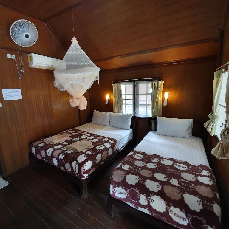 Postel nebo postele na pokoji v ubytování Silver Sands Resort - Koh Tao