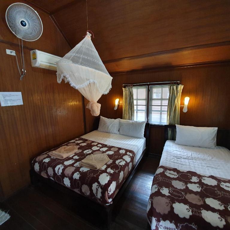 Postel nebo postele na pokoji v ubytování Silver Sands Resort - Koh Tao