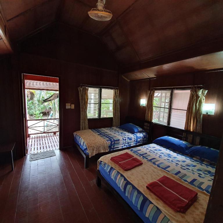 Postel nebo postele na pokoji v ubytování Silver Sands Resort - Koh Tao