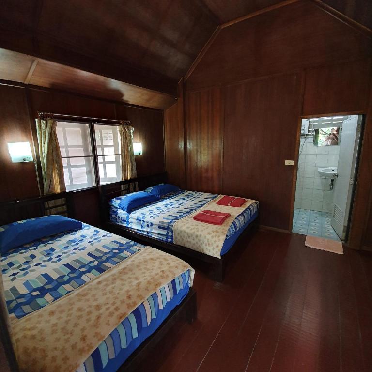 Postel nebo postele na pokoji v ubytování Silver Sands Resort - Koh Tao