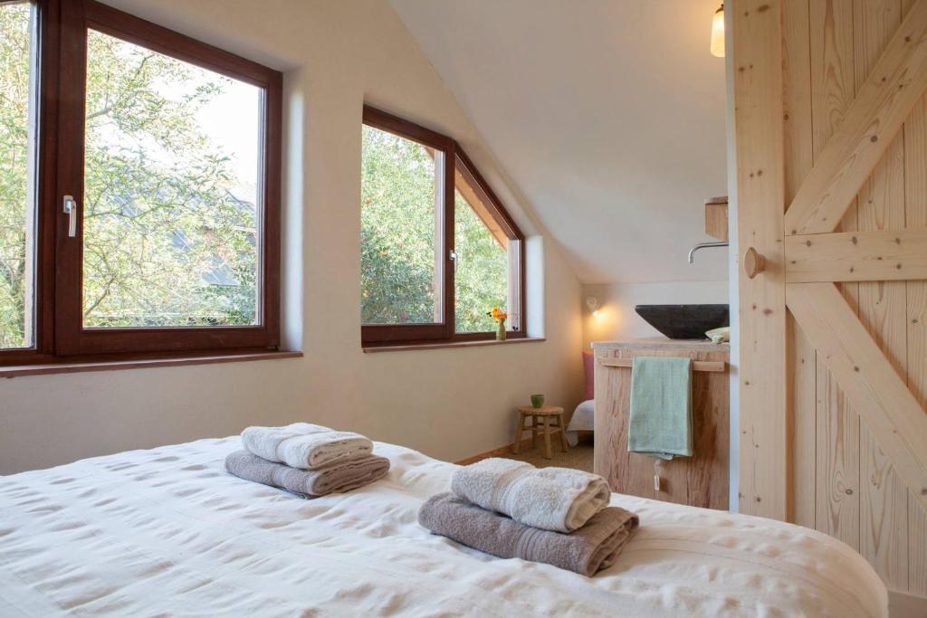 Postel nebo postele na pokoji v ubytování Ecolodge de Parel Schoorl