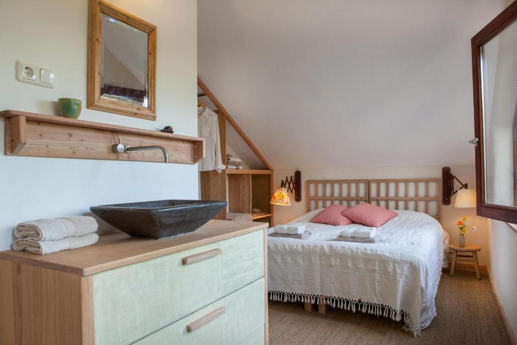 Postel nebo postele na pokoji v ubytování Ecolodge de Parel Schoorl