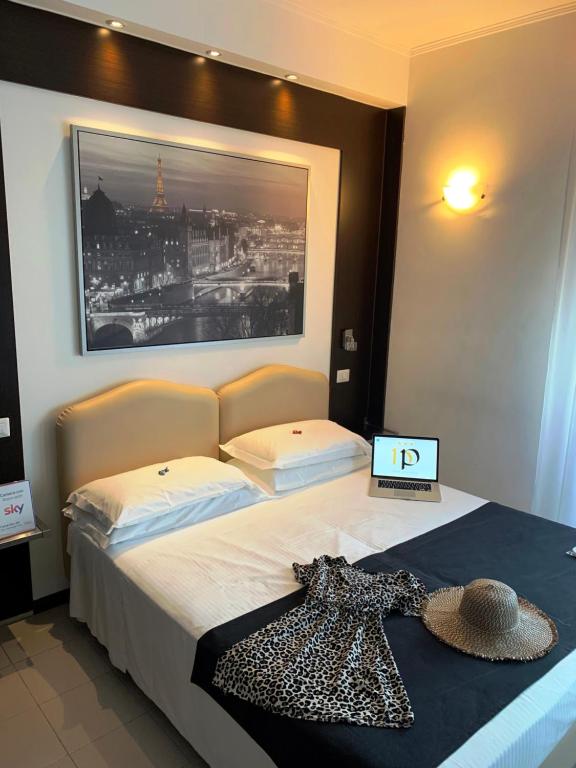 Postel nebo postele na pokoji v ubytování Hotel Perugino