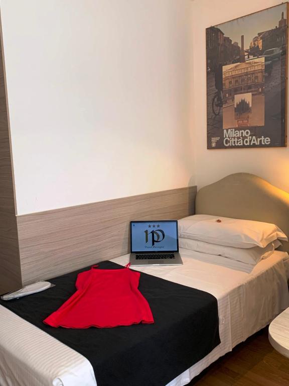 Postel nebo postele na pokoji v ubytování Hotel Perugino