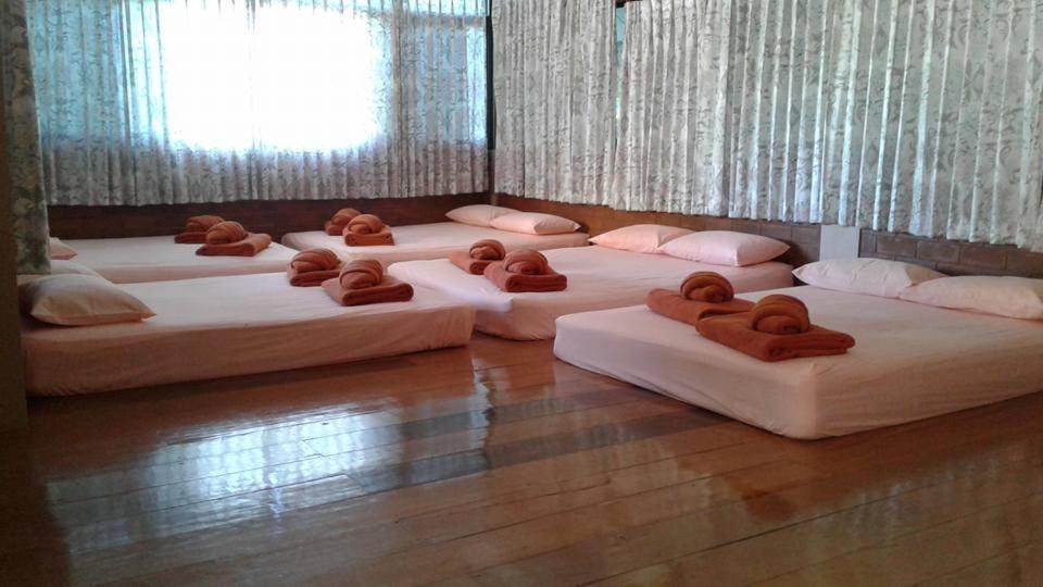 Postel nebo postele na pokoji v ubytování สุขทวีรีสอร์ท อ่าวมะนาว