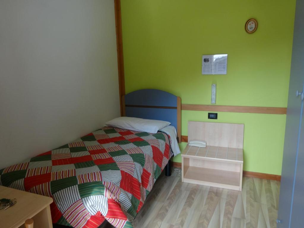 Postel nebo postele na pokoji v ubytování Hotel Genzianella