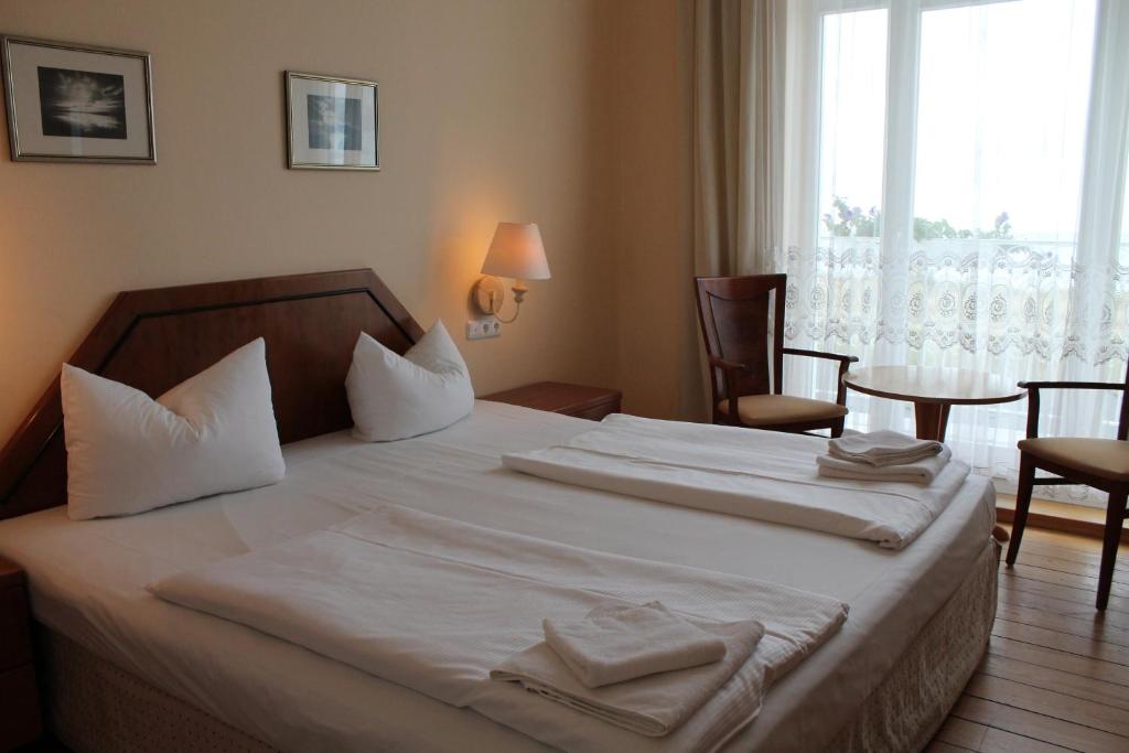 Postel nebo postele na pokoji v ubytování Hotel Stolteraa