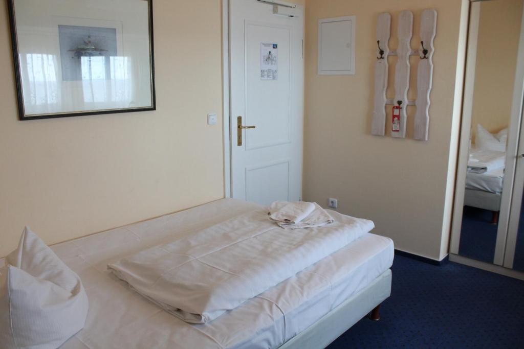 Postel nebo postele na pokoji v ubytování Hotel Stolteraa